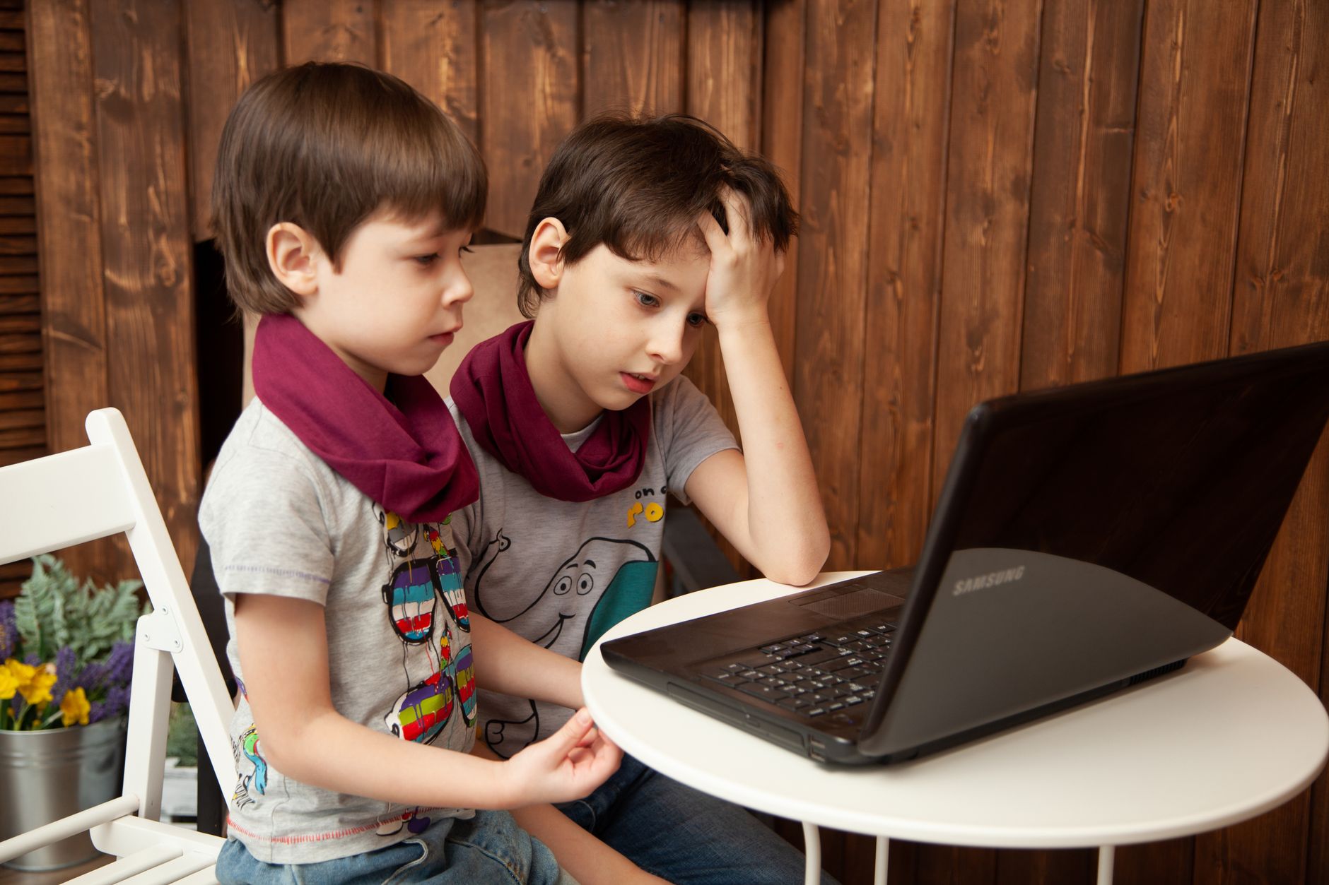 boys looking at computer screen